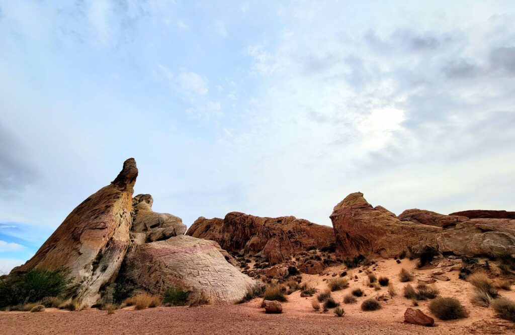 red rock formations on valley of Fire state Park with a cloud filled sky in the background