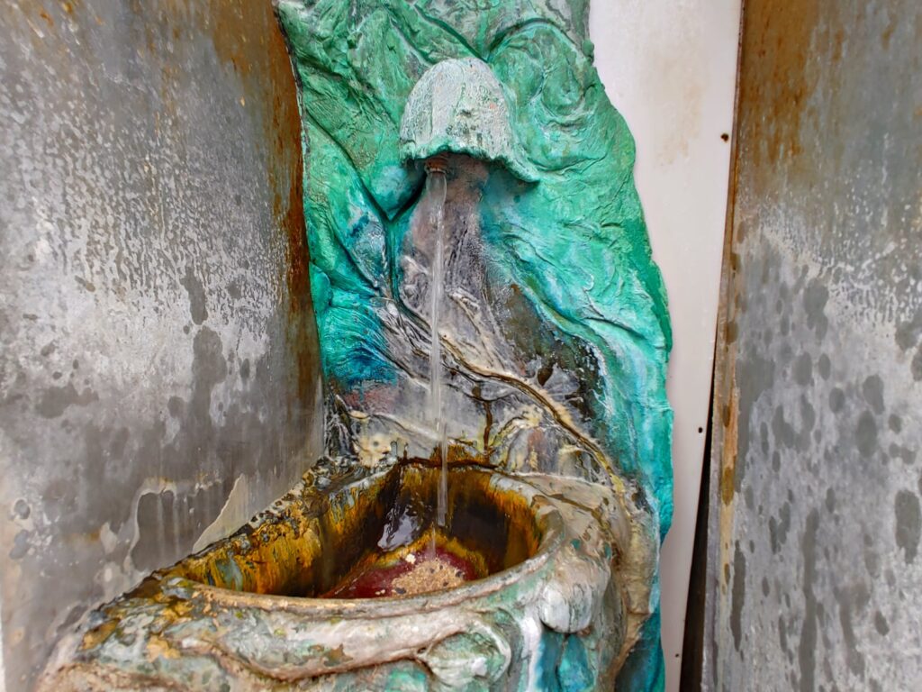 Close-up of flowing Twin Spring mineral water fountain