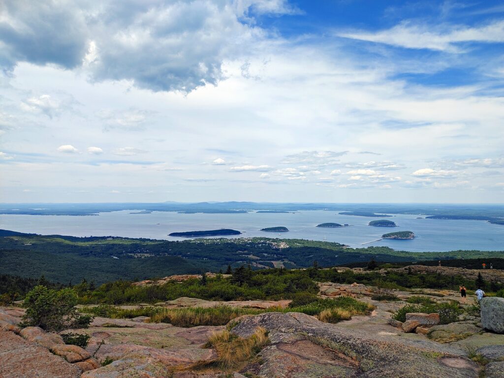 View from Cadillac Mountain overlooking the rocky coastline and islands of Acadia National Park in Maine.