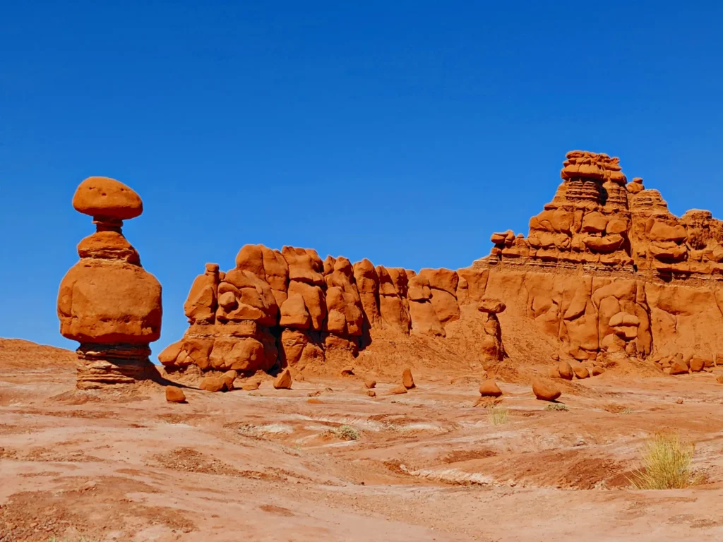 Unique mushroom-shaped hoodoos in the desert landscape of Goblin Valley State Park.