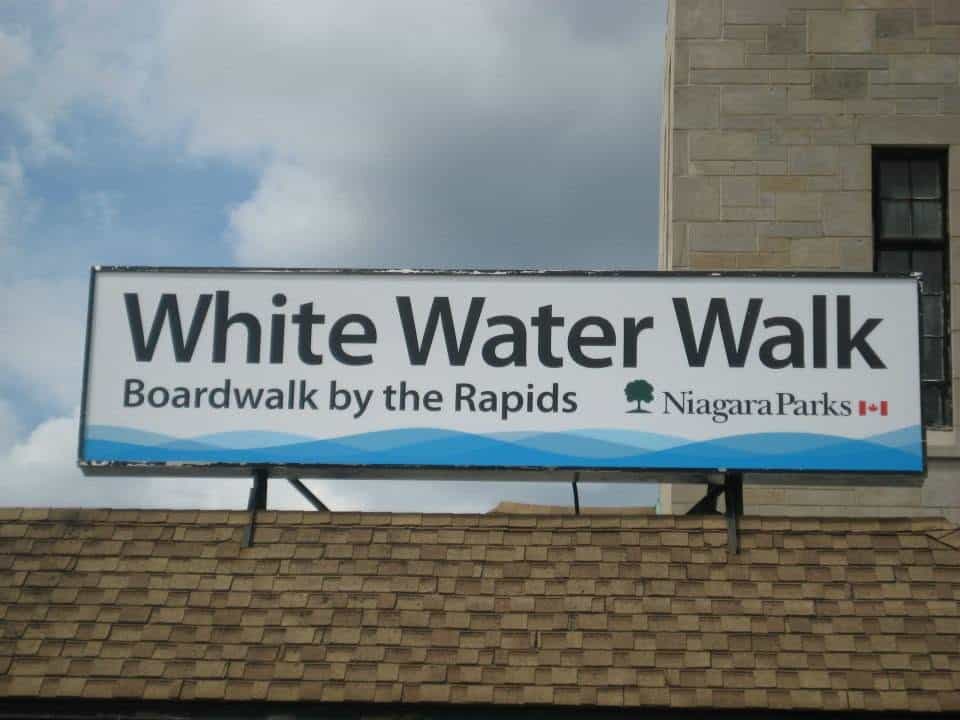 Entrance sign for the White Water Walk, a popular Niagara Falls attraction featuring views of the Niagara River rapids.
