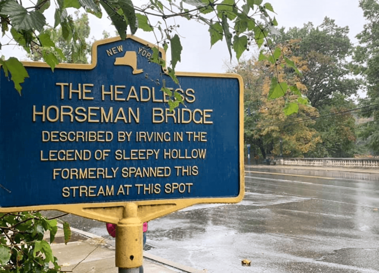 a blue sign marking the location of the original bridge that inspired Irving's The Headless Horseman