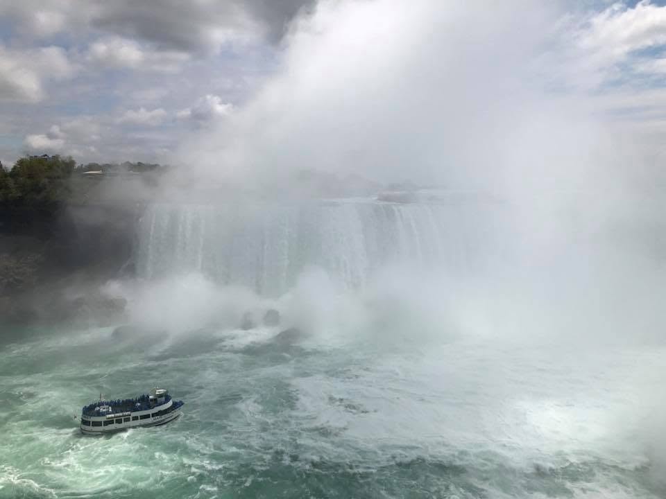 Maid of the Mist boat approaching the powerful Horseshoe Falls at Niagara Falls State Park.