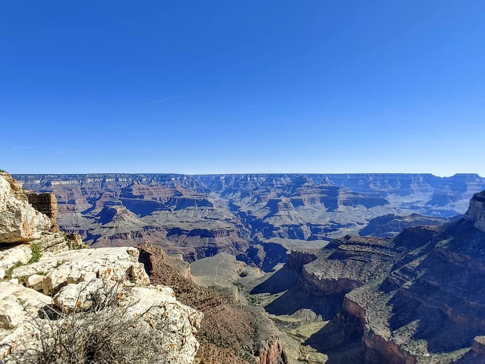 Grand Canyon National Park with expansive views of the colorful canyon walls and rugged landscape.