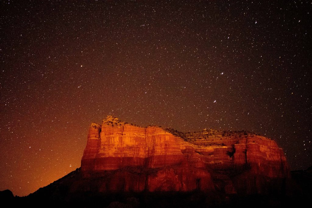 Sedona Red Rocks at night with a star filled night sky 